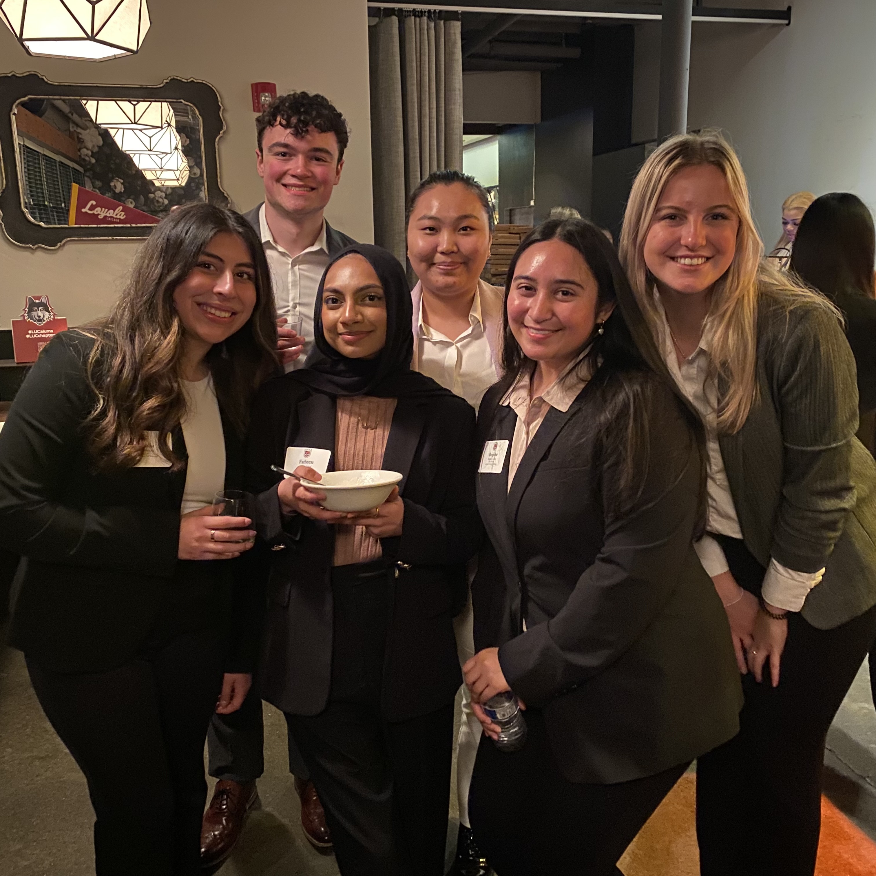 A group of students pose for a photo at the Alumni Reception in San Francisco.